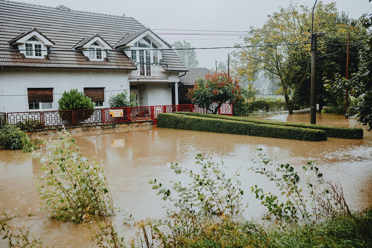 house submerged in flood